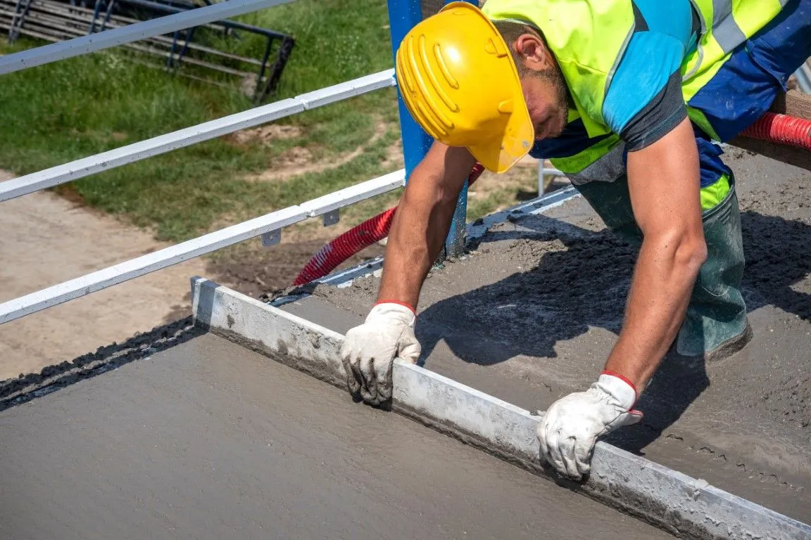Professional concrete leveling service in Millington TN - worker smoothing concrete surface